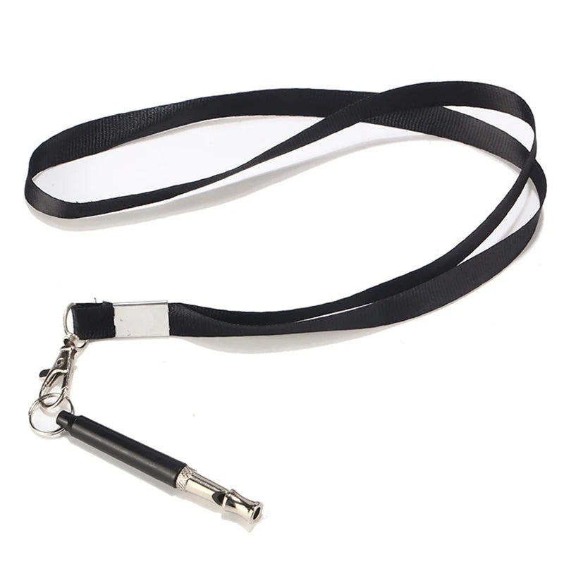 Black adjustable dog training whistle with a silver clip and lanyard attached.