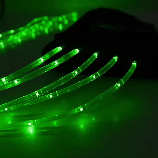 A close-up of a green LED horse tail light with multiple flexible filaments illuminating the surface.