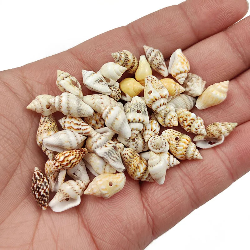 A handful of natural white and beige sea shell beads for jewelry making