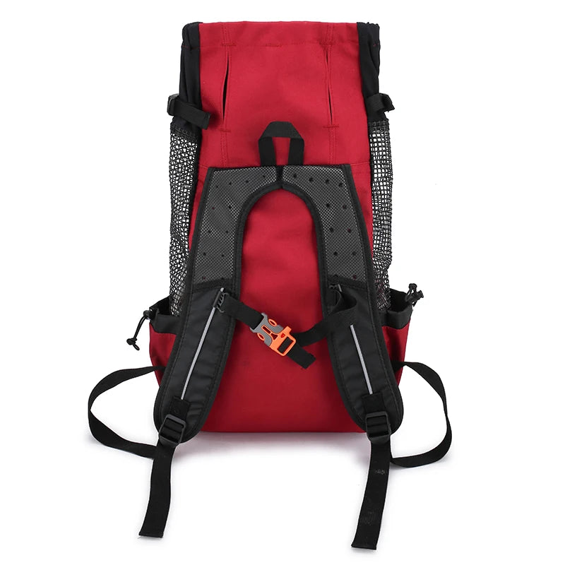 A red breathable dog backpack carrier with black mesh and straps.