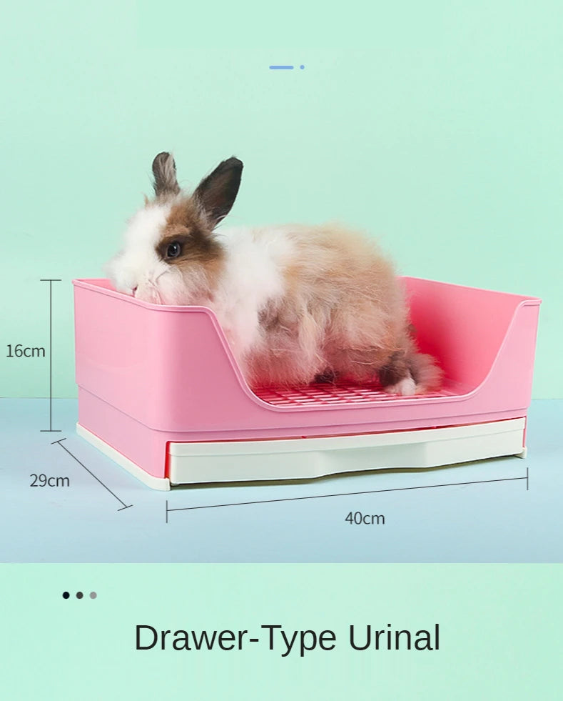 A pink drawer-type urinal for small pets, featuring a rabbit resting inside.