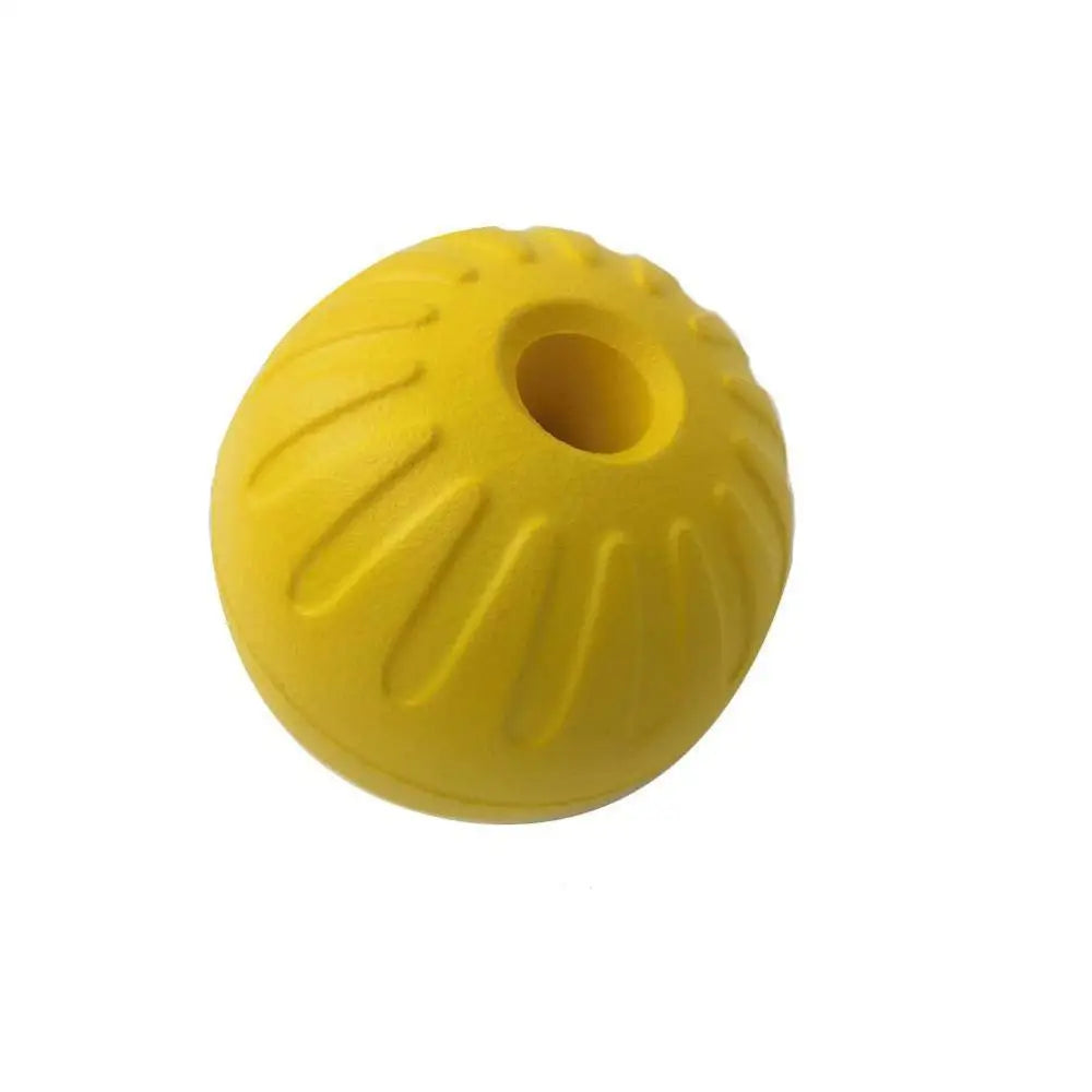 Yellow durable rubber dog chew ball with a rope for fetch and training.