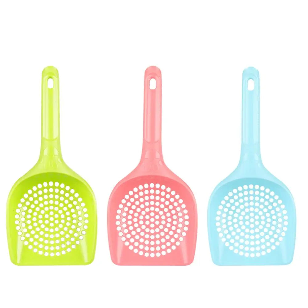 Three plastic pet litter scoops in lime green, pink, and light blue.