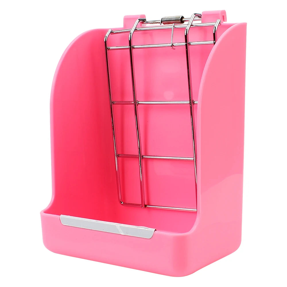 Râtelier à foin rose pour lapin avec grille métallique pour un entretien propre de la cage.