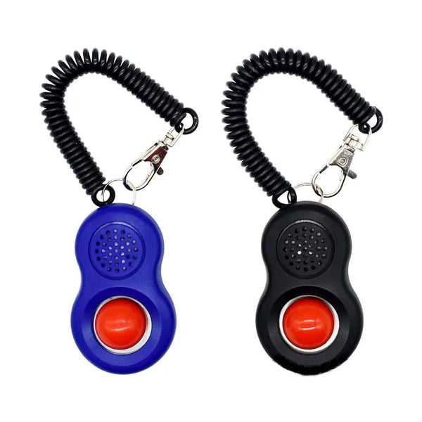 A black pet training clicker with a finger loop and wrist band, featuring blue and black components.