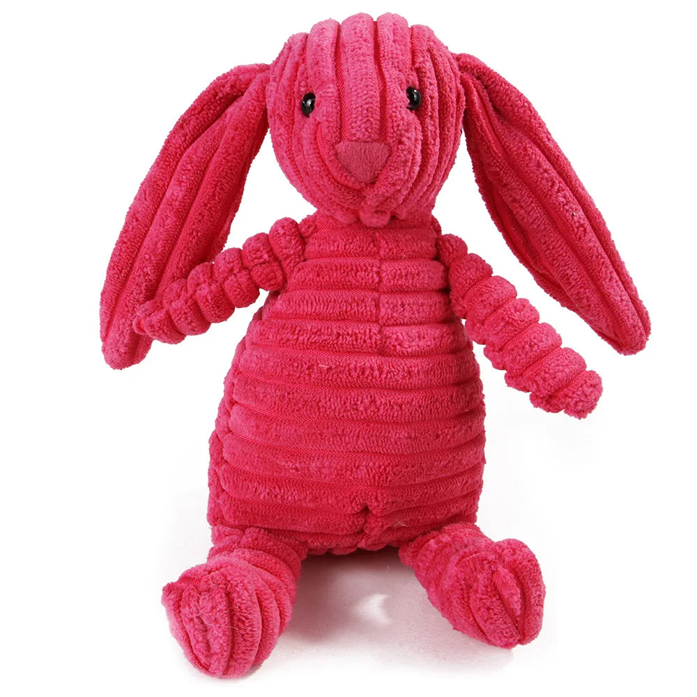 Jouet à mâcher en forme de lapin rose vif et texturé pour les dents de l'animal de compagnie.