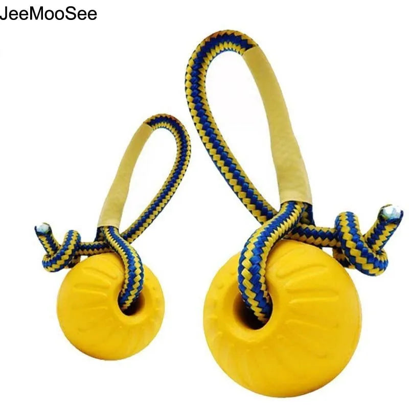 Yellow rubber dog chew ball with blue rope for fetch and training