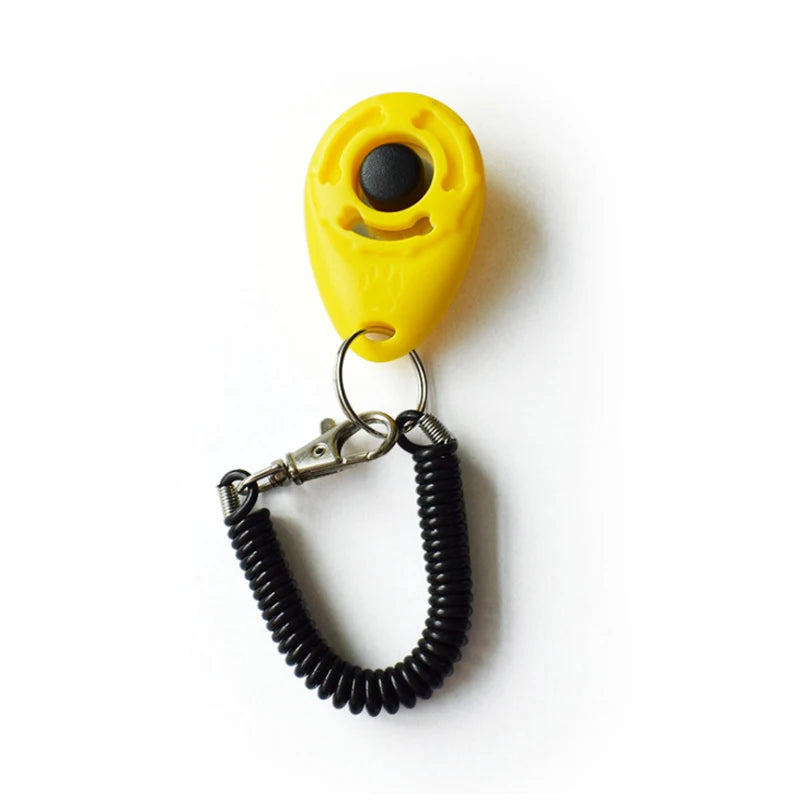Yellow pet training clicker with a black sensor and a metal wrist strap attached.