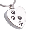A silver stainless steel heart-shaped pet memorial necklace with four paw prints engraved on the pendant.