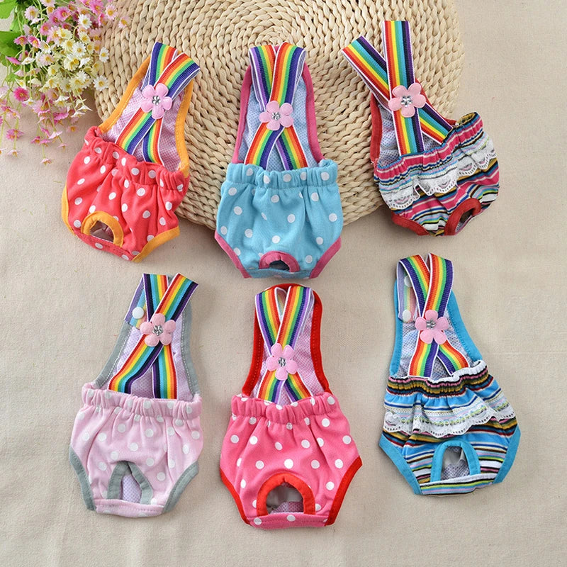 A set of colorful washable physiological dog underwear featuring rainbow stripes and floral accents.