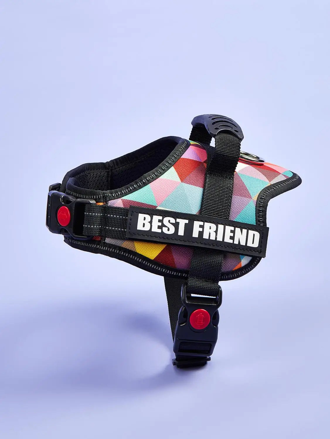 A colorful no-pull dog harness vest with reflective stripes and a black strap is shown against a light background.