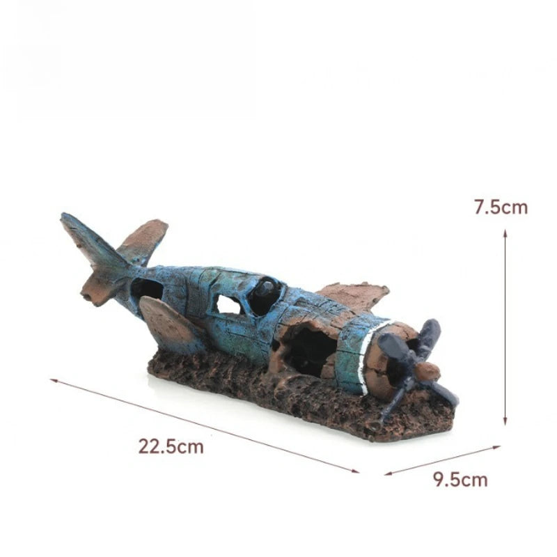 A model of a sunken ship with a cave hideout for fish tanks, featuring weathered blue-green and brown textures.