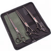 A black case holds a pair of professional stainless steel pet grooming scissors and a comb.