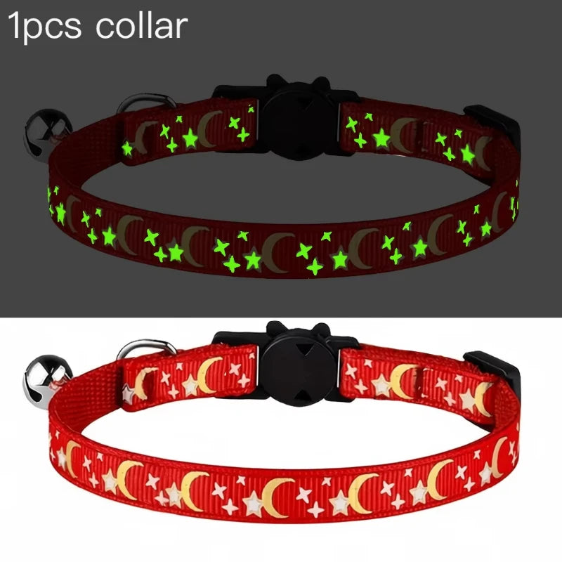 A red collar with green and yellow stars and crescent moons, featuring a bell, designed for pets.
