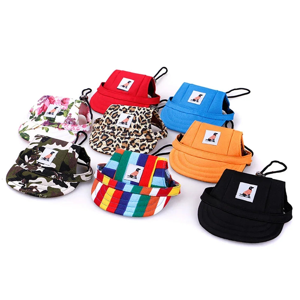 A collection of colorful pet grooming and fashion visor caps for dogs and cats in various patterns and colors.