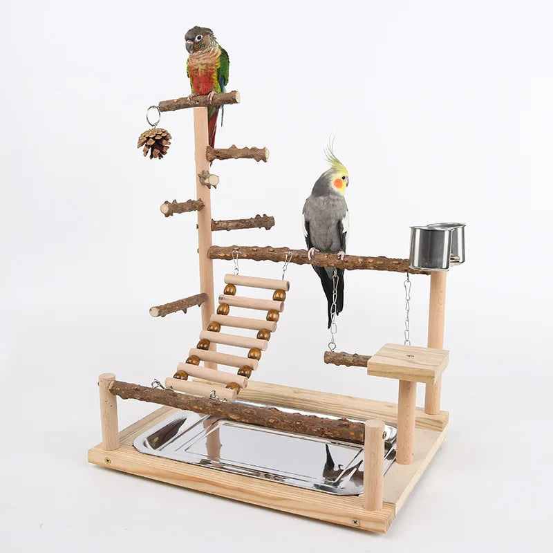 A wooden parrot climbing platform featuring branches, bridges, and a feeding tray for a pet bird.