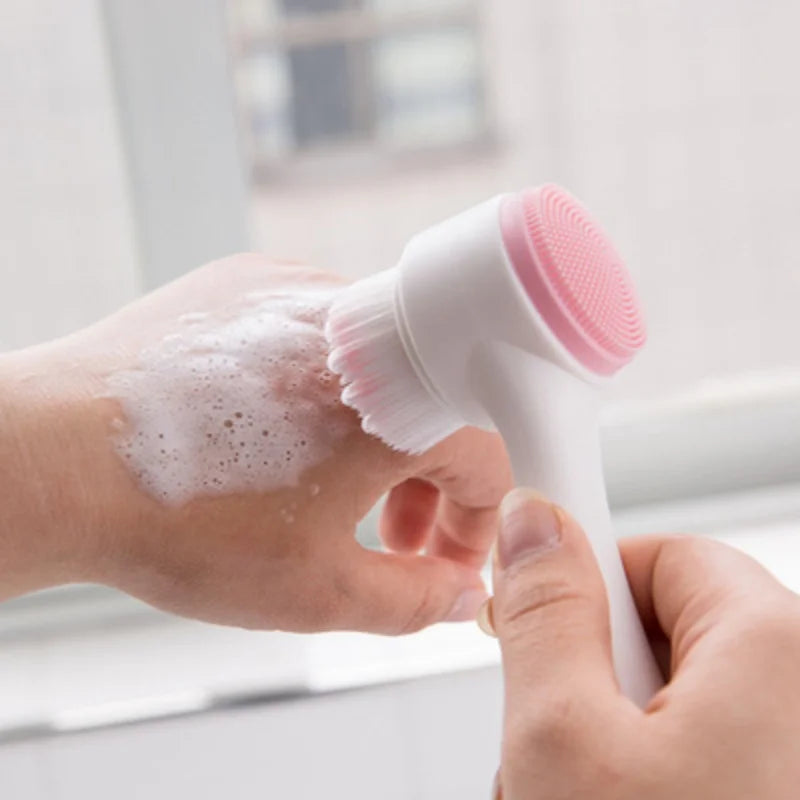 A hand is using a white pet paw cleaner with a pink brush to clean a pet's paw.