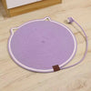 Purple cat scratching mat with a self-play ball and attached string