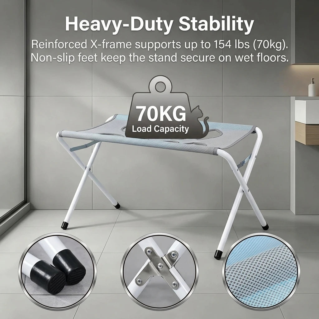 A foldable pet grooming hammock station showing a white X-frame stand with non-slip feet and a load capacity label.