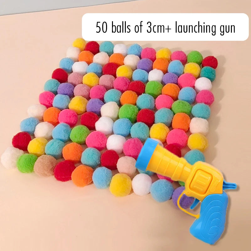 A colorful launcher with 50 plush balls is shown, ready for launching.