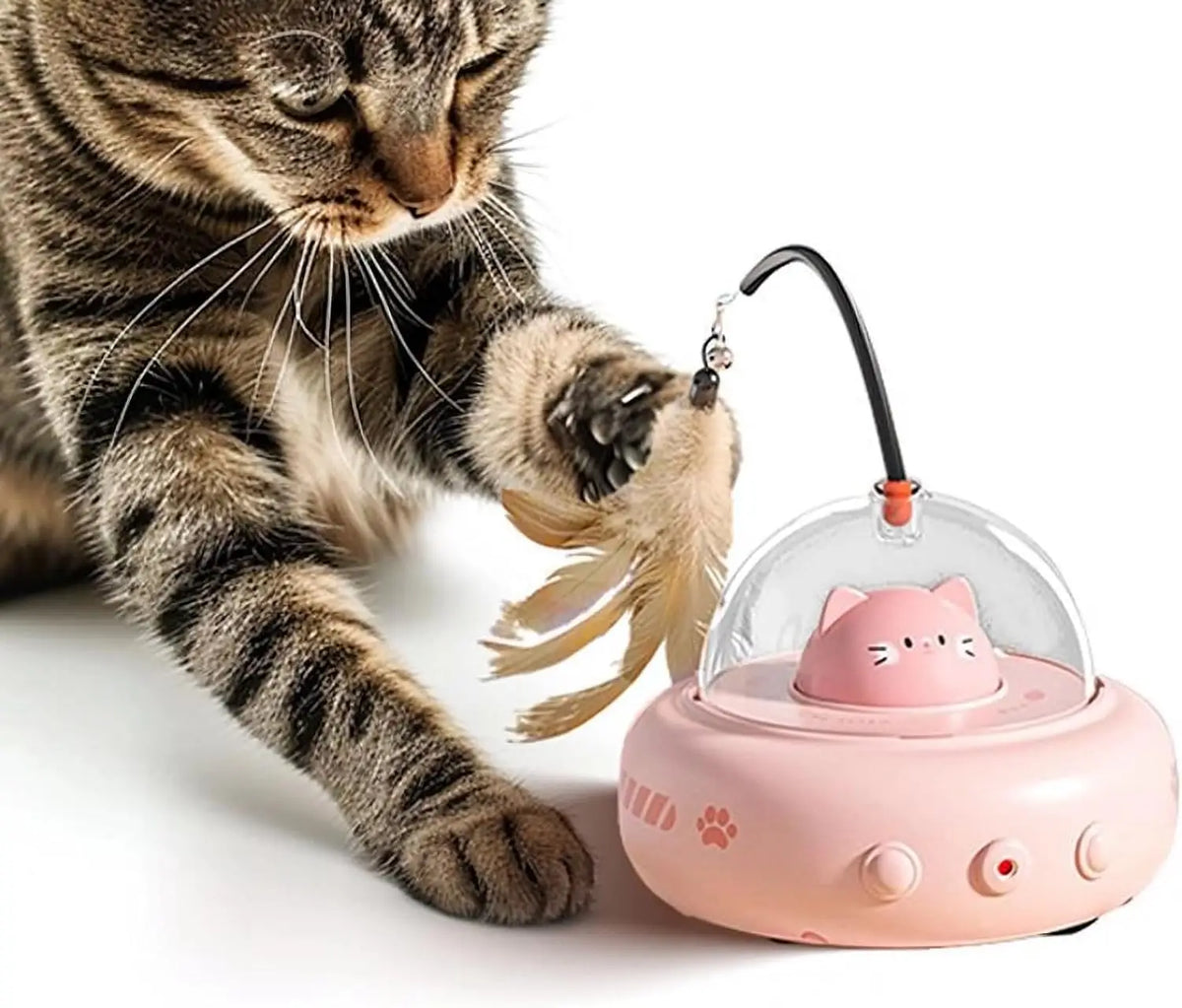 A tabby cat is interacting with an electronic toy featuring a pink dome and a black wand with feathers.