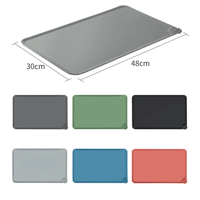 A rectangular gray silicone pet feeding mat with raised edges and non-slip grip shown from above.