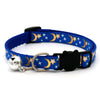 Blue pet collar with a bell necklace featuring gold stars and crescent moons on a dark blue fabric.