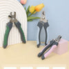 A collection of stainless steel pet nail clippers in various colors resting on a light surface.