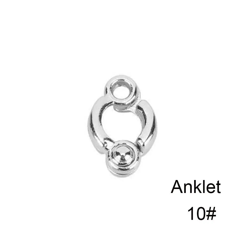 Silver ankle bracelet with a decorative charm and anti-bite leg ring.