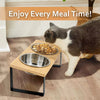 Elevated wooden pet bowls with stainless steel feeding stand for cats and small dogs placed on a wooden floor.