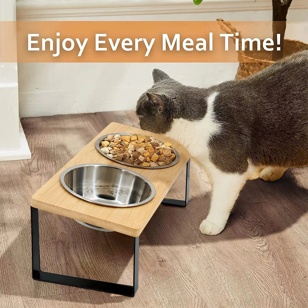 Elevated wooden pet bowls with stainless steel feeding stand for cats and small dogs placed on a wooden floor.