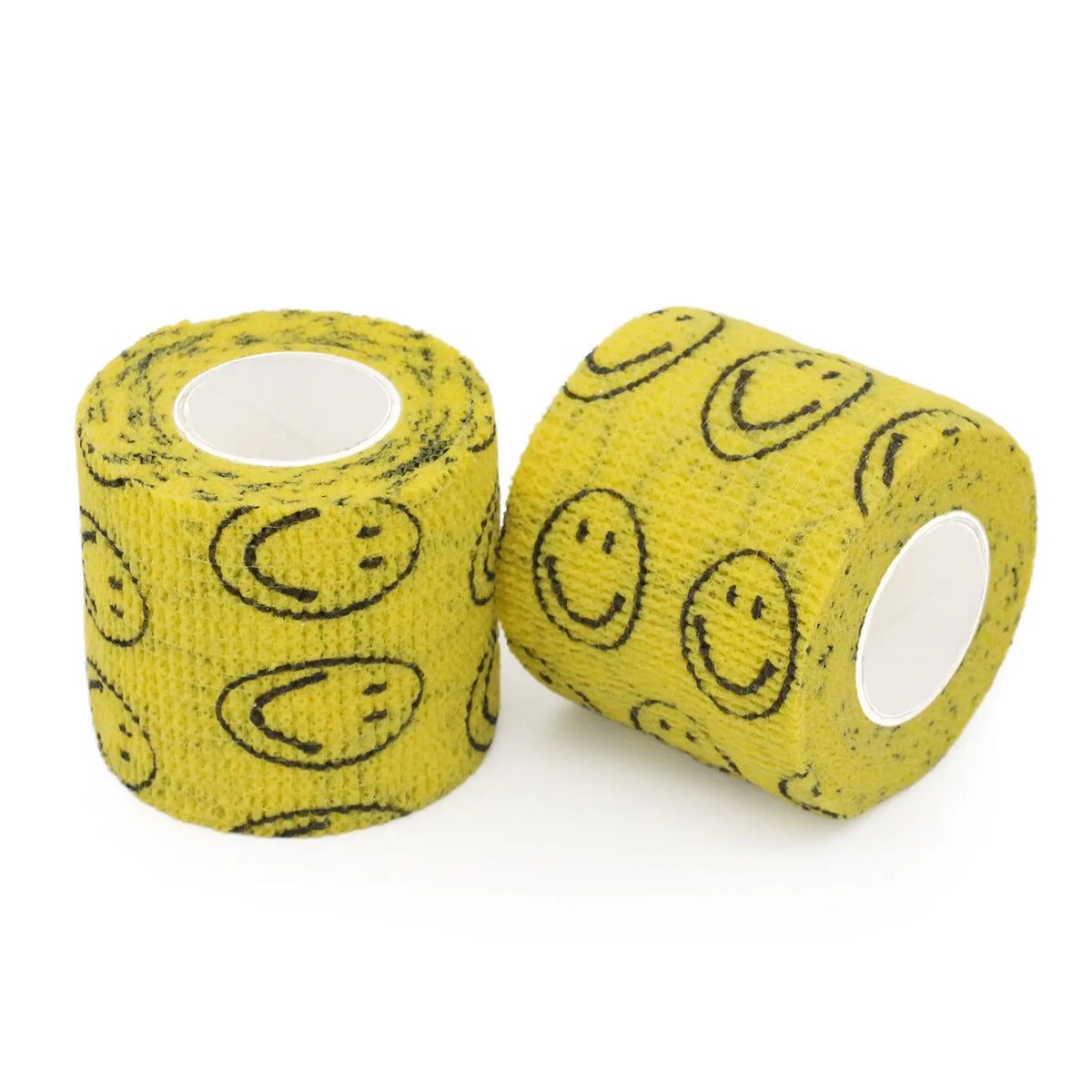 Rolle gelber selbstklebender Tattoo-Griffverband mit schwarzen Smiley-Designs.