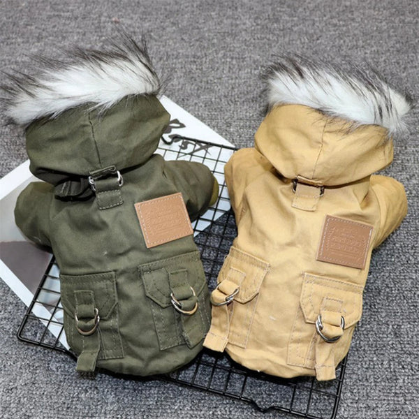 A pair of cozy hooded winter jackets for small dogs in olive green and tan, displayed on a black wire rack.