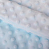 A close-up of a white, textured cozy hanging sleeping bag for small pets.
