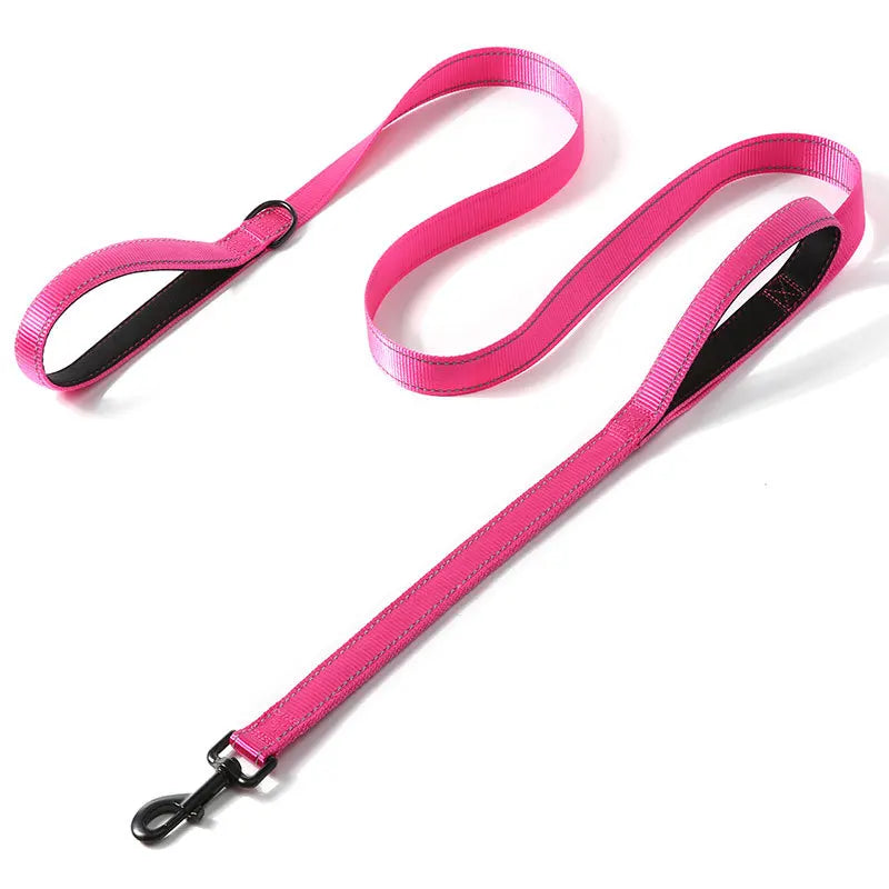 A pink heavy duty reflective dog leash with dual handles shown against a white background.