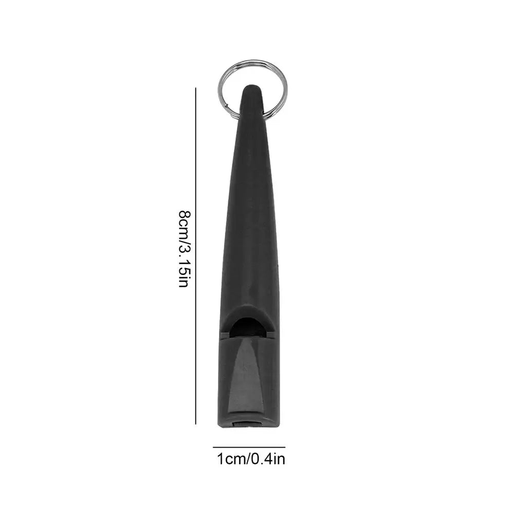 Sifflet compact noir pour l'entraînement des chiens avec boucle métallique et design pointu.