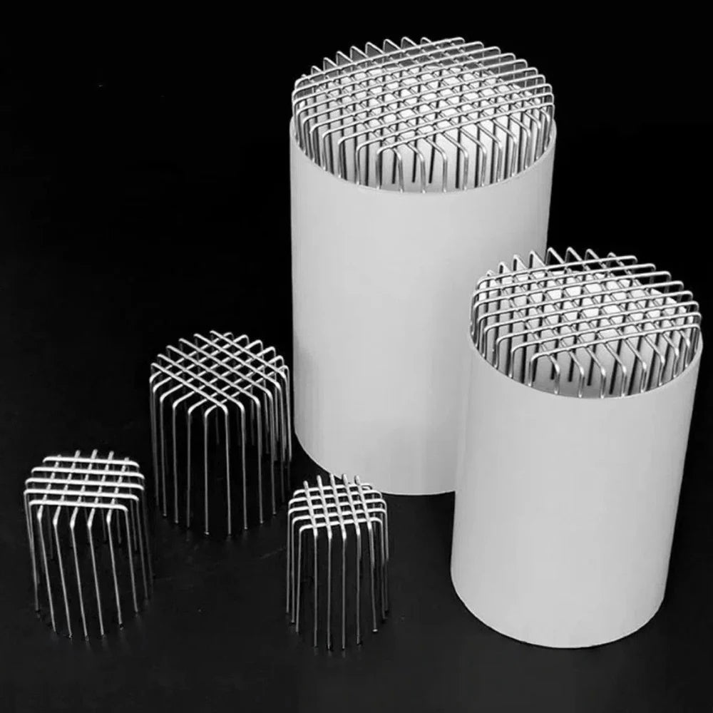 Three stainless steel roof and floor drain mesh covers of varying sizes displayed against a black background.