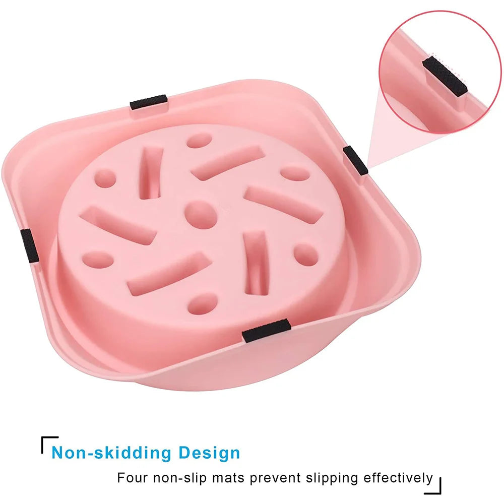 A pink non-skid puzzle bowl for dogs with four indentations designed to slow down eating.