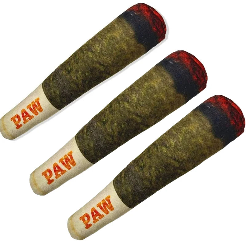 A set of three cigar-shaped plush dog toys with olive green bodies and red tips.