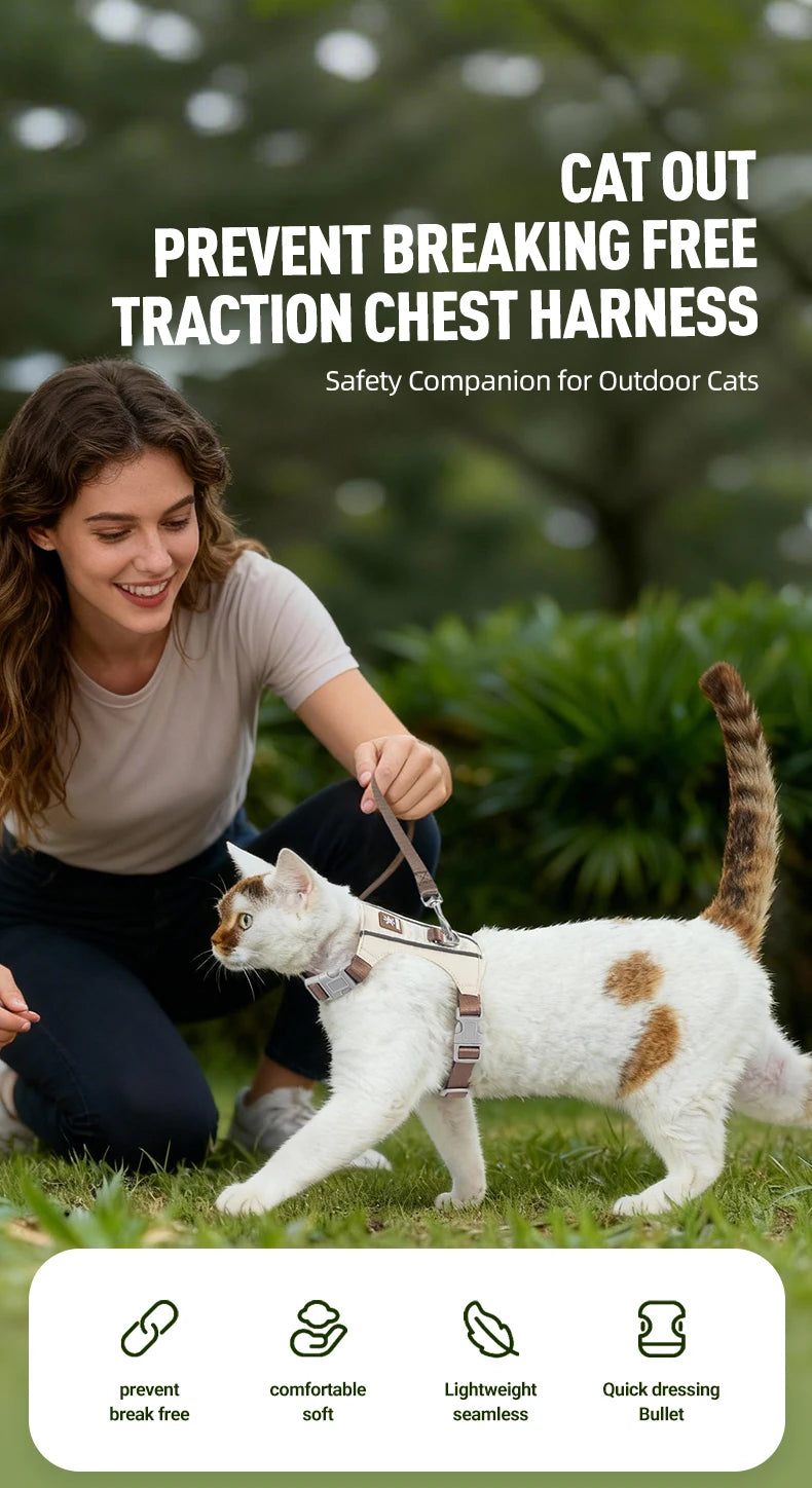 A woman is holding a cat wearing an escape-proof chest harness outdoors.