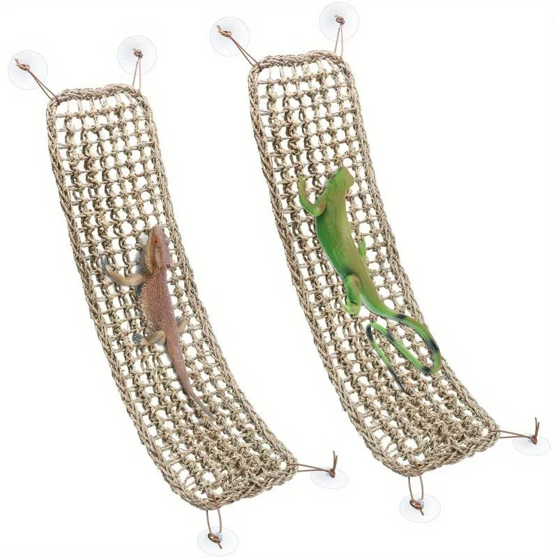 A woven natural fiber reptile hammock lounger with a green lizard inside.