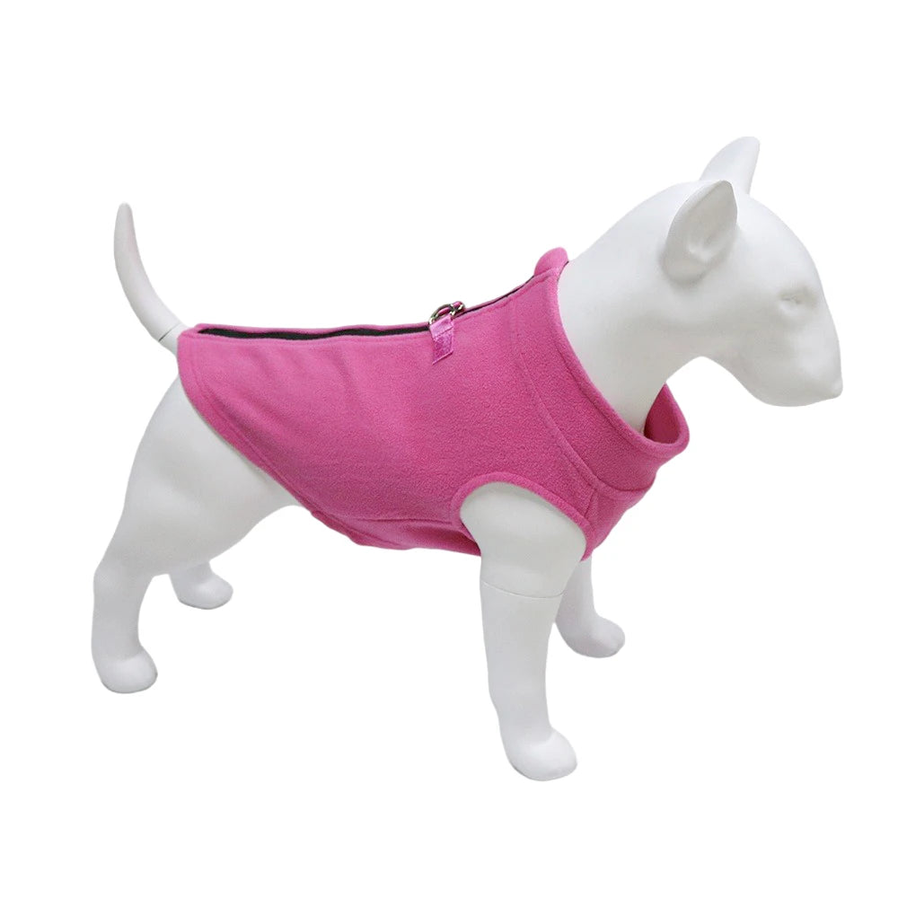 A white dog model wearing a pink soft fleece vest.