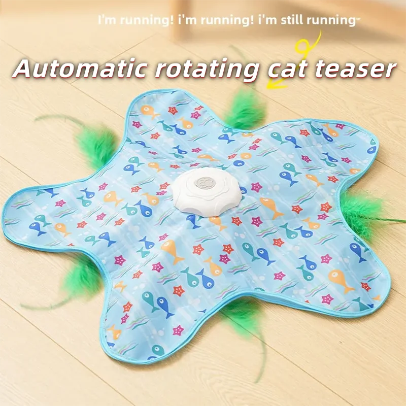 Jouet de chat rotatif en forme d'étoile bleu clair avec une balle blanche et des plumes vertes sur une surface en bois.