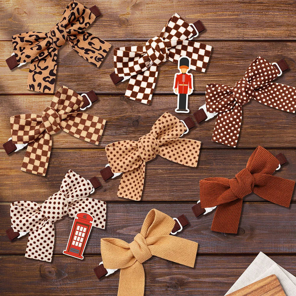 A collection of pet bow ties featuring plaid, polka dots, and solid colors for dogs and cats.