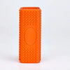 Orange silicone pet hair remover brush with a rounded oval indentation on the side