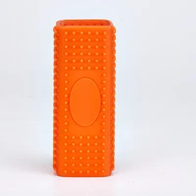 Orange silicone pet hair remover brush with a rounded oval indentation on the side