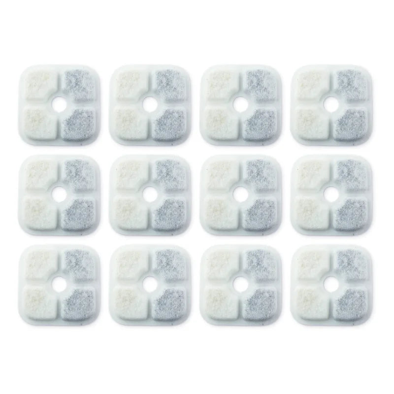A pack of twelve replacement filters for a Catit PIXI water fountain, showing small, white, porous filter discs.