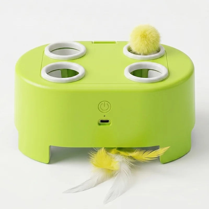 A lime green rechargeable interactive cat toy with three circular targets and a yellow feather ball lying in front of it.