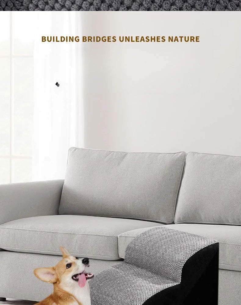 A dog is resting on a gray memory foam pet ramp placed on a light-colored sofa.