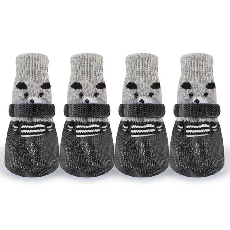 A set of pet paw protection socks for small dogs and cats, featuring gray knitted designs with black accents.